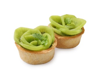 Photo of Tartlets with kiwi and mint isolated on white. Delicious dessert