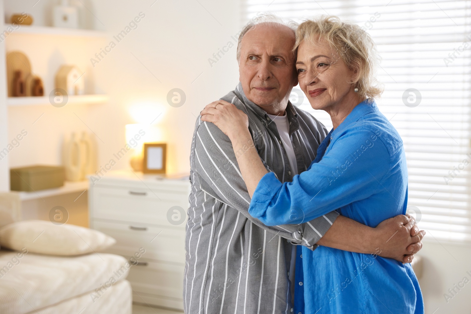Lovely senior couple at home, space for text Photo of Lovely senior couple at home, space for text