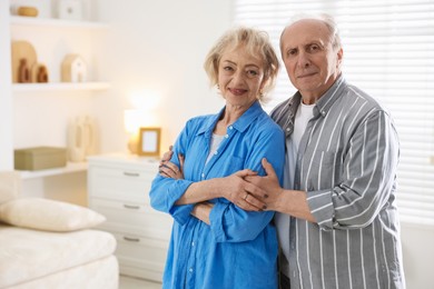Photo of Lovely senior couple at home, space for text