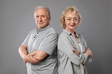 Photo of Portrait of lovely senior couple on grey background