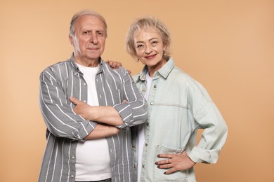 Photo of Portrait of lovely senior couple on beige background