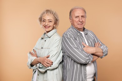 Photo of Portrait of lovely senior couple on beige background