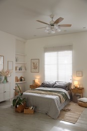 Photo of Comfortable bed with soft linens and blankets in room. Home textile