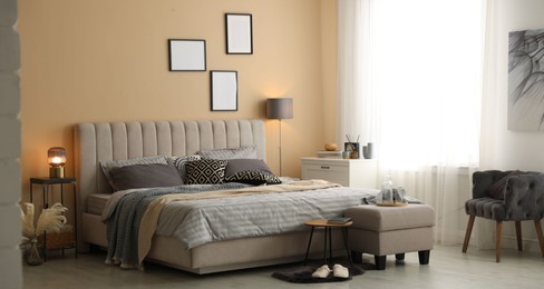 Photo of Comfortable bed with soft linens and blankets in room. Home textile
