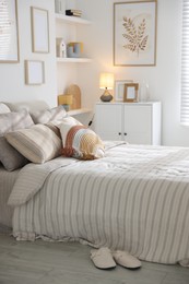 Photo of Comfortable bed with soft linens in room. Home textile