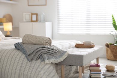 Photo of Comfortable bed with soft linens in room. Home textile