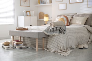 Photo of Comfortable bed with soft linens in room. Home textile