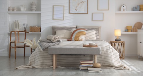 Photo of Comfortable bed with soft linens in room. Home textile