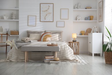 Photo of Comfortable bed with soft linens in room. Home textile