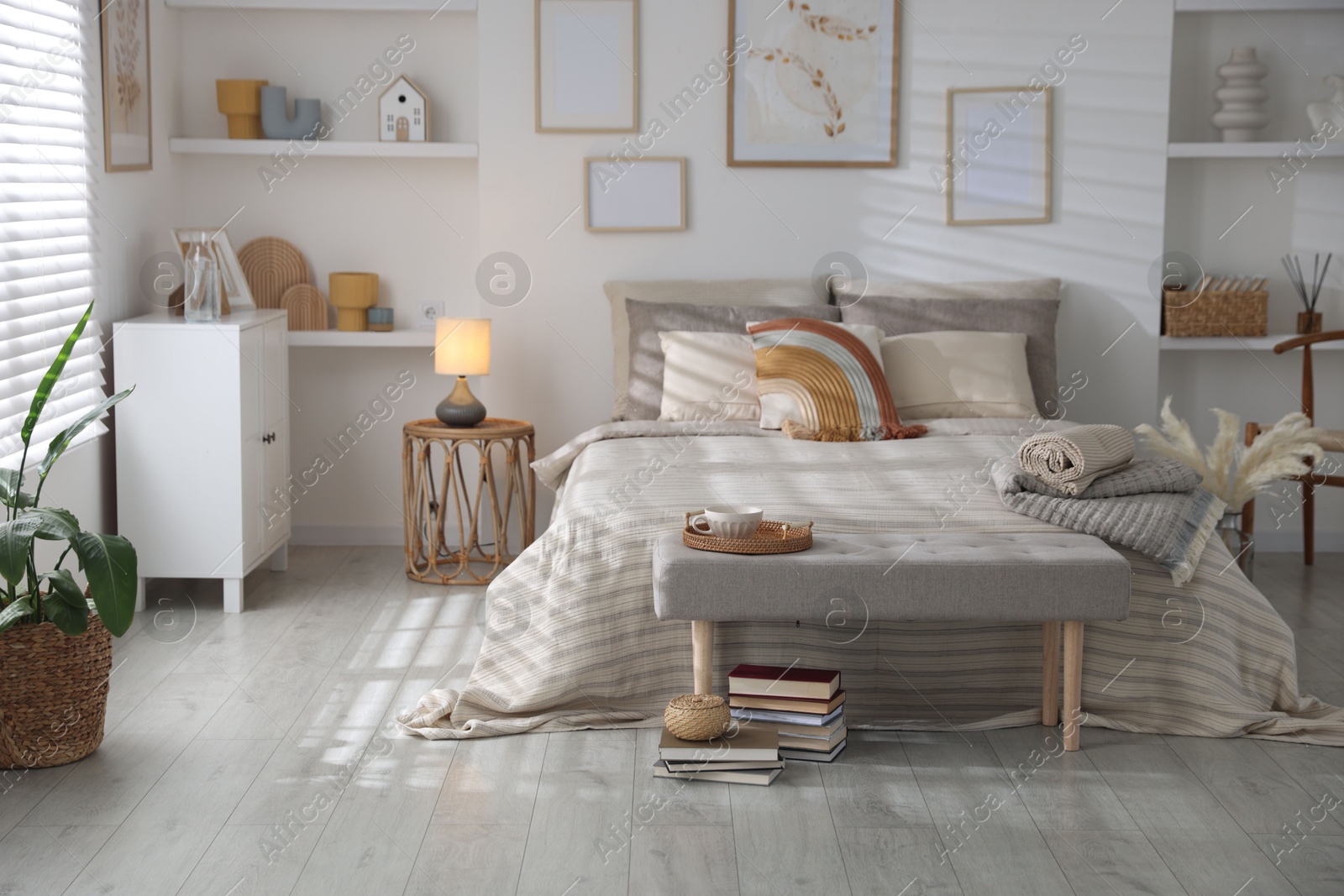 Photo of Comfortable bed with soft linens in room. Home textile