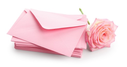 Photo of Stack of love letters and flower isolated on white
