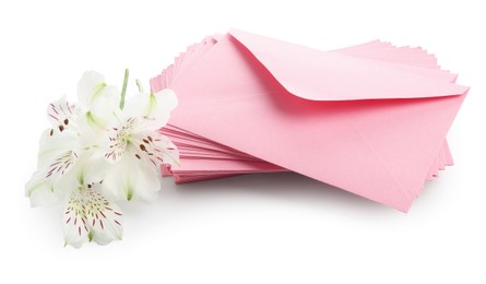 Photo of Stack of love letters and flowers isolated on white