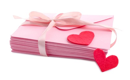 Photo of Stack of love letters and paper hearts isolated on white