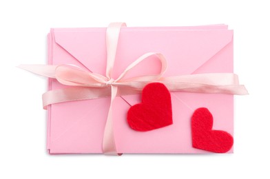 Photo of Stack of love letters and paper hearts isolated on white, top view