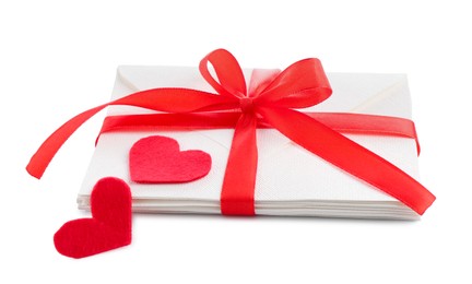 Photo of Stack of love letters and paper hearts isolated on white