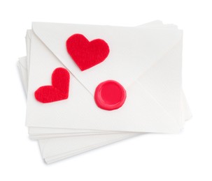 Photo of Stack of love letters and paper hearts isolated on white, top view