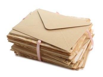 Photo of Stack of love letters in envelopes isolated on white