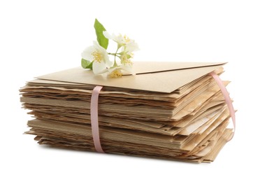 Photo of Stack of love letters and flowers isolated on white