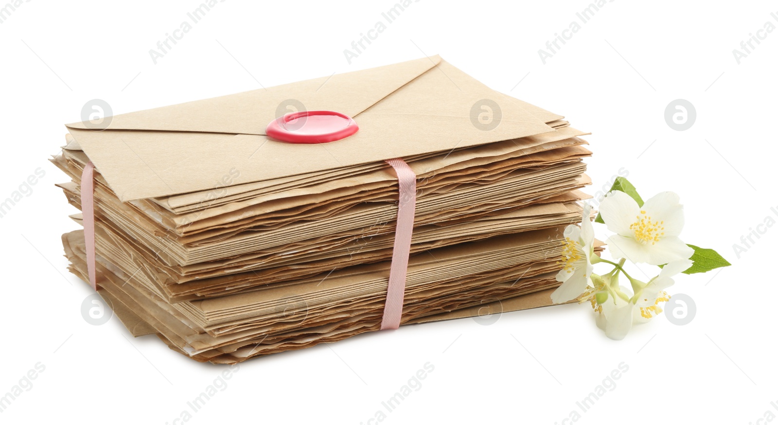 Stack of love letters and flowers isolated on white Photo of Stack of love letters and flowers isolated on white