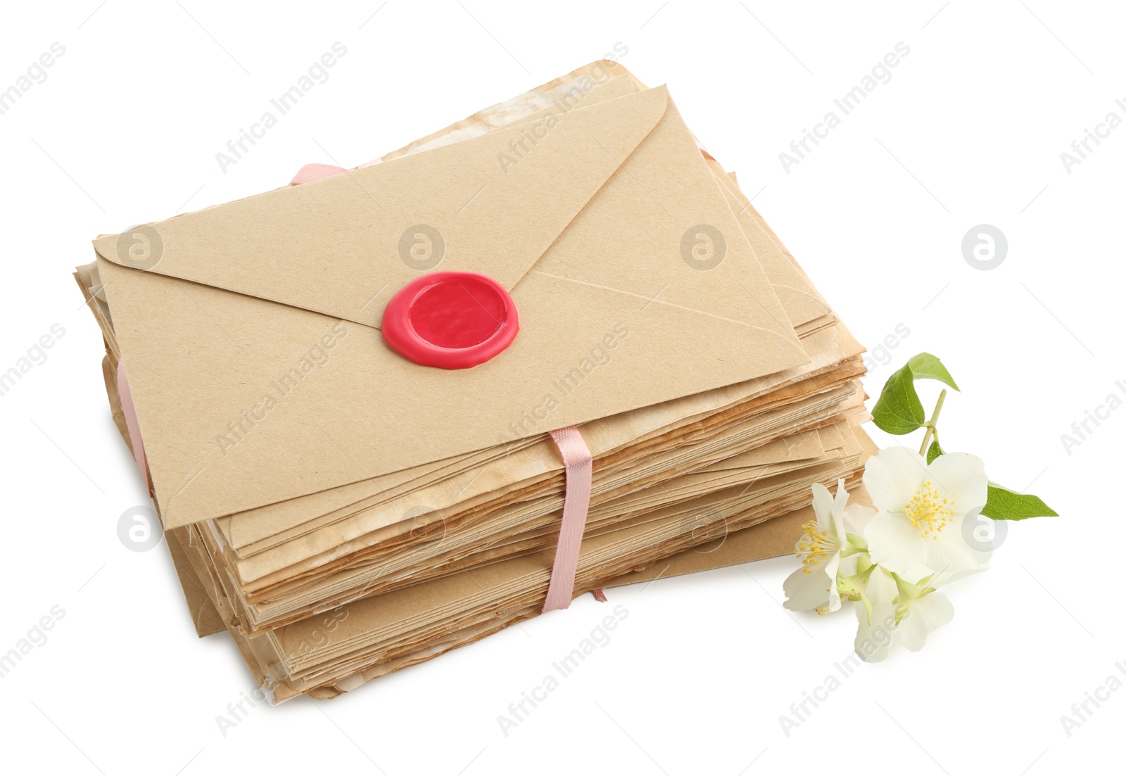 Photo of Stack of love letters and flowers isolated on white