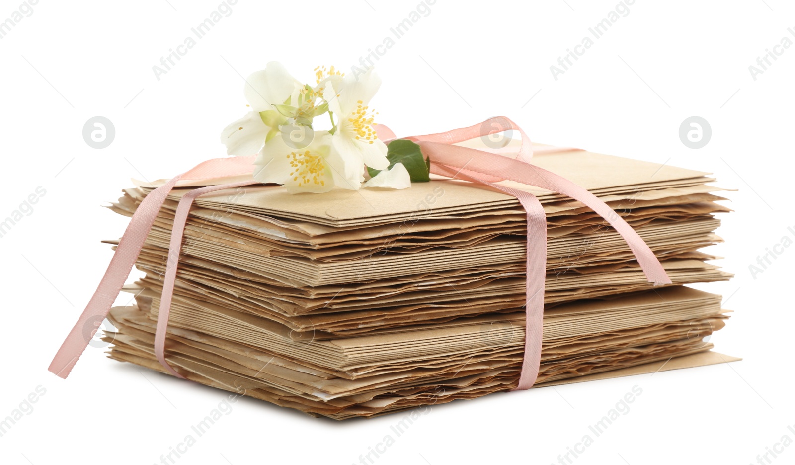 Stack of love letters and flowers isolated on white Photo of Stack of love letters and flowers isolated on white