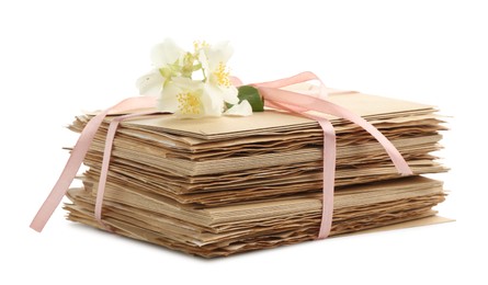 Photo of Stack of love letters and flowers isolated on white