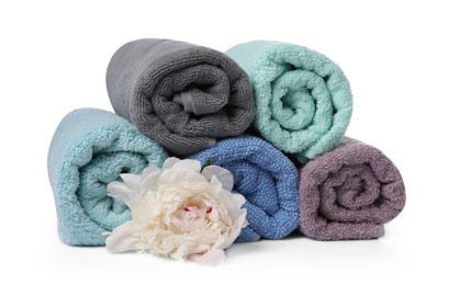 Photo of Soft towels and peony flower isolated on white