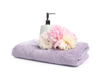 Photo of Soft towel, liquid soap and peony flower isolated on white