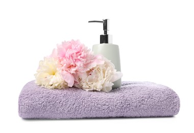 Photo of Soft towel, liquid soap and peony flower isolated on white