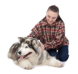 Photo of Woman with her beautiful Alaskan malamute dog on white background
