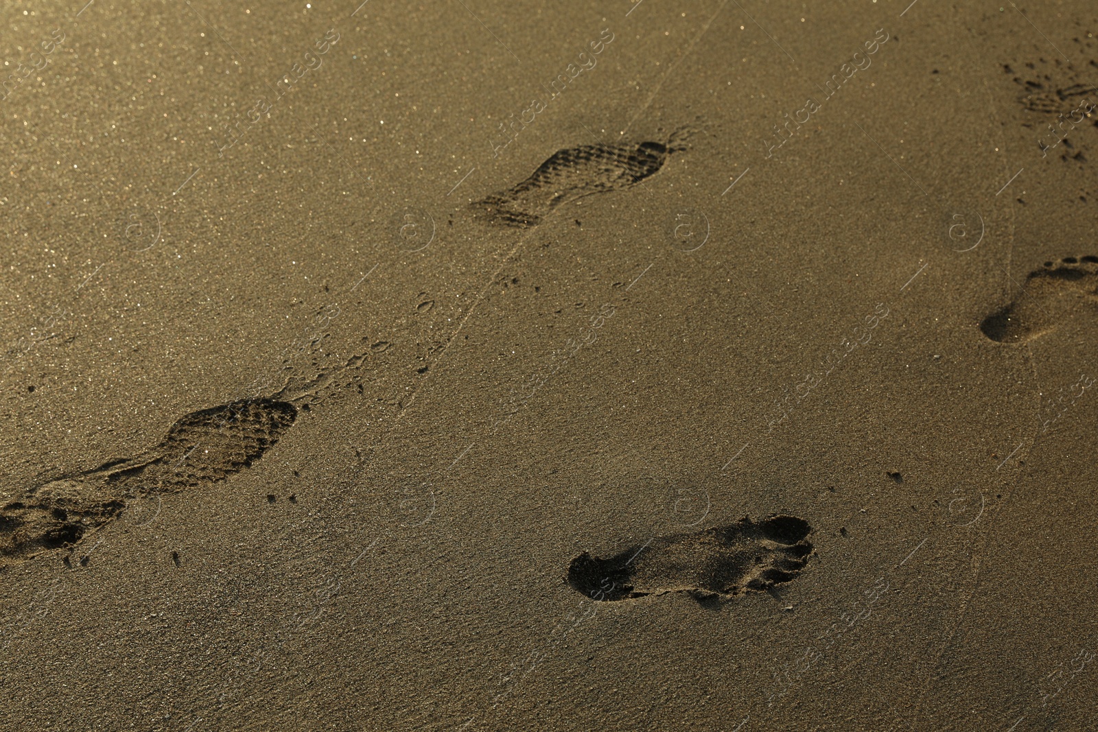 Many footprints on sand as background, closeup Photo of Many footprints on sand as background, closeup