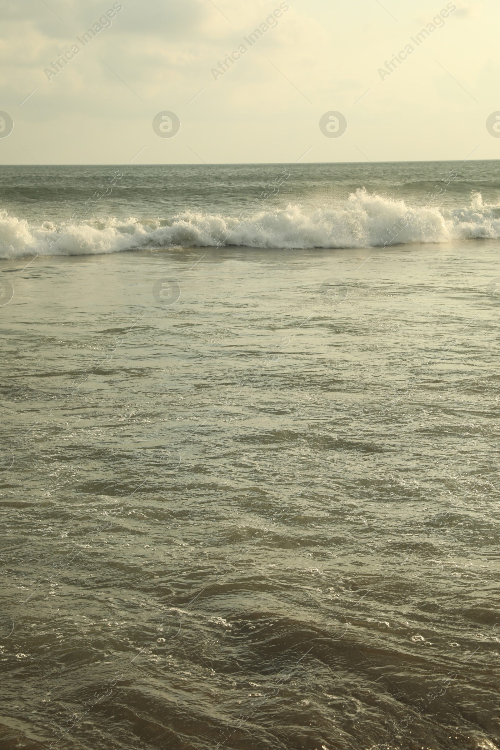 Beautiful sea and cloudy sky at tropical beach Photo of Beautiful sea and cloudy sky at tropical beach