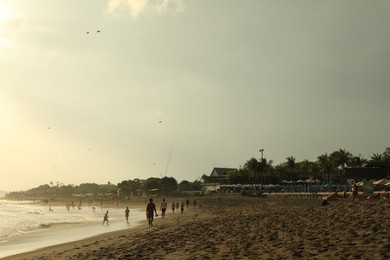 Photo of Bali, Indonesia - May 20, 2025: View of tropical beach at sunrise