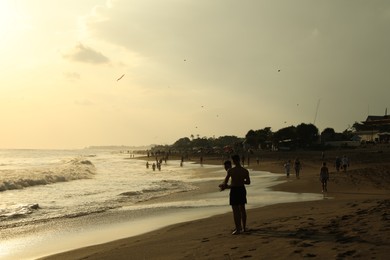 Photo of Bali, Indonesia - May 20, 2025: View of tropical beach at sunrise