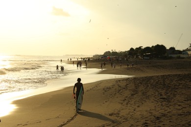 Photo of Bali, Indonesia - May 20, 2025: View of tropical beach at sunrise
