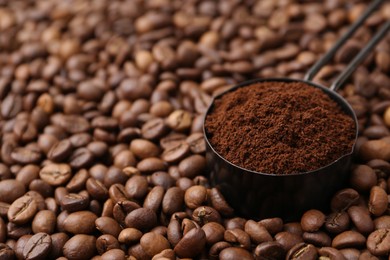 Photo of Scoop with instant coffee powder on beans, closeup. Space for text