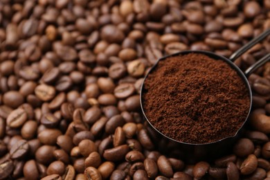 Photo of Scoop with instant coffee powder on beans, closeup. Space for text