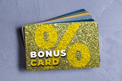 Image of Bonus cards on textured table, top view