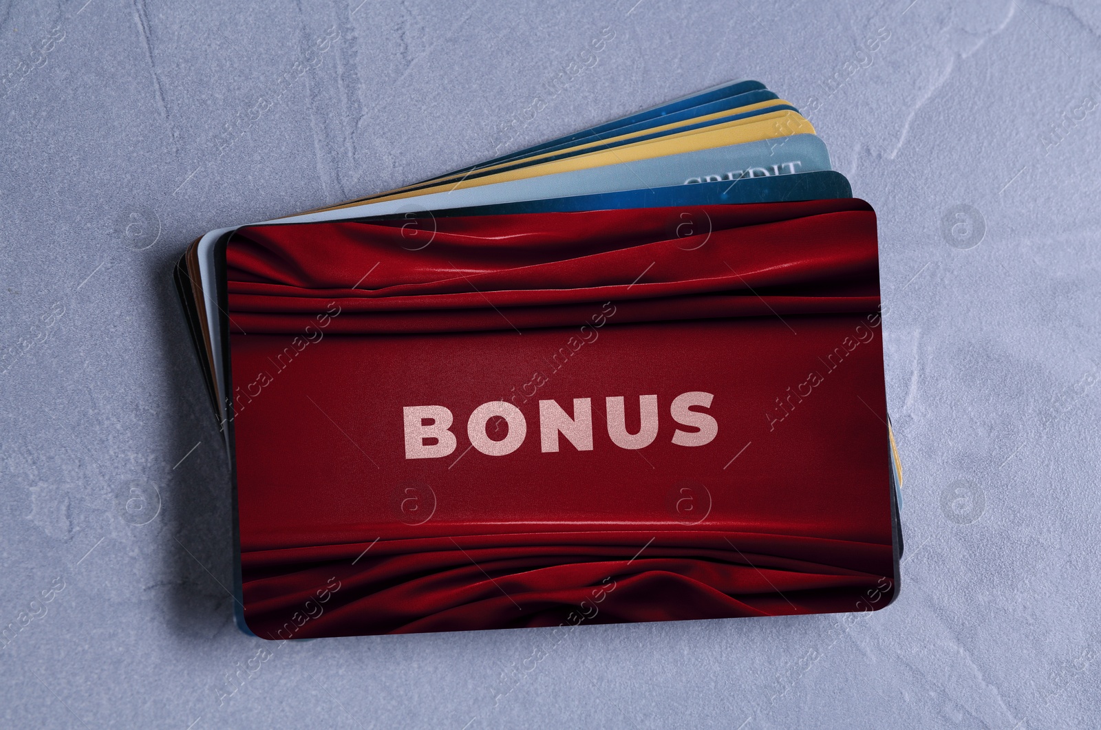 Bonus cards on textured table, top view Image of Bonus cards on textured table, top view