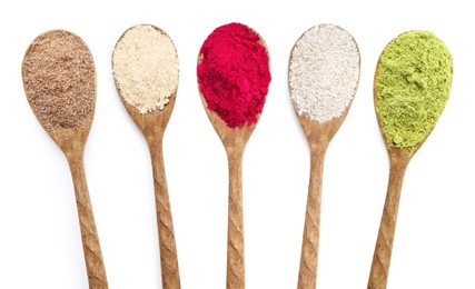 Image of Different superfood powders in wooden spoons on white background, collage. Top view