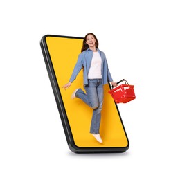 Image of Happy woman with shopping basket jumping out of mobile phone on white background. Online ordering