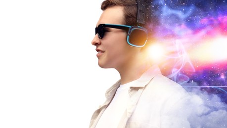Image of Young man listening to music with headphones on white background, double exposure with universe