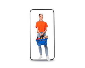 Image of Happy woman with shopping basket walking out of mobile phone on white background. Online ordering