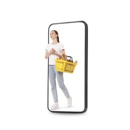 Image of Happy woman with shopping basket walking out of mobile phone on white background. Online ordering