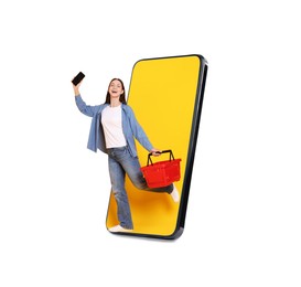 Image of Happy woman with shopping basket walking out of mobile phone on white background. Online ordering