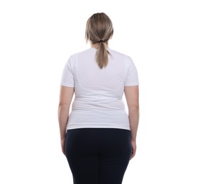 Photo of Weight loss. Plus size woman on white background, back view