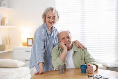 Photo of Portrait of lovely senior couple at home