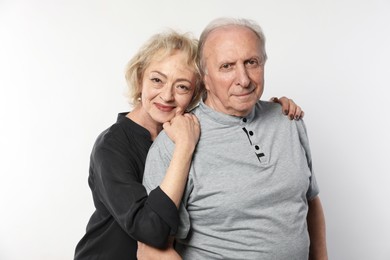 Photo of Portrait of lovely senior couple on white background