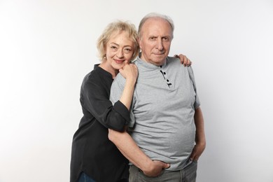 Photo of Portrait of lovely senior couple on white background