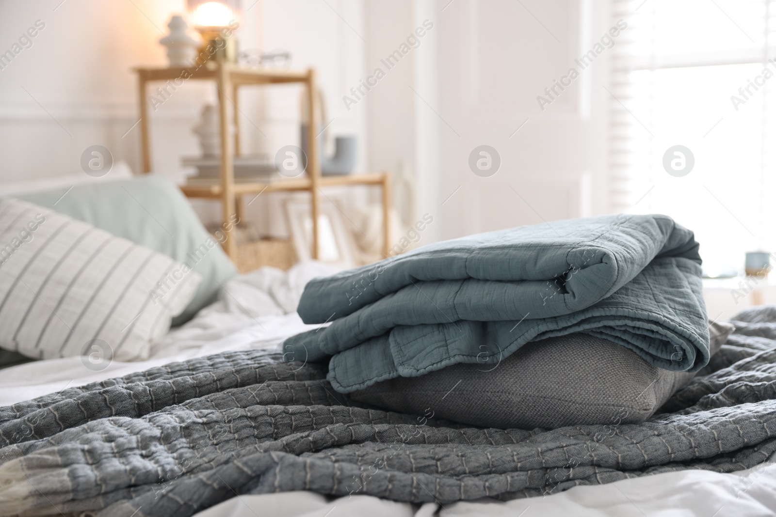 Fresh linens on bed indoors. Home textile Photo of Fresh linens on bed indoors. Home textile